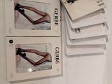 four books on a table with a pair of heels on top of them