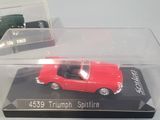two toy cars in a clear box on a table