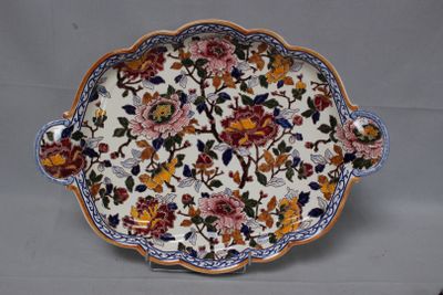 a plate with a floral design on it on a table