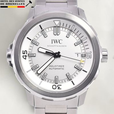 a silver watch with roman numerals on the face