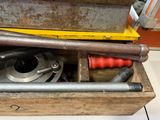 a metal pipe that is sitting on top of a wooden box