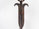 an image of a wall sconce with a knife on it
