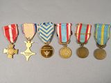 several medals are lined up in a row on a table