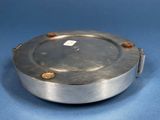 an image of a silver plate on a blue surface