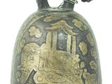a bell with a dragon on it on a white background