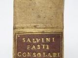 an old book sitting on top of a table with a label on it