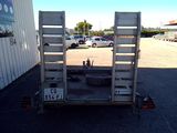 an image of a truck with a trailer in a parking lot