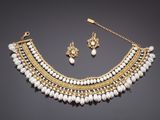 a gold and pearl necklace and earring set