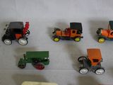 a lot of toy cars and trucks on a table