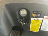 a close up of a gas tank with a meter on it