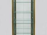 a glass display case with gold trimming and gold trimming