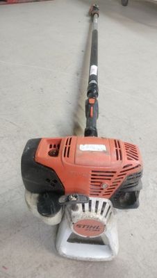 an image of a string stringing machine on the ground