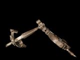 an image of a pair of metal tools on a black background