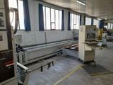 a machine that is working in a factory with a lot of machines