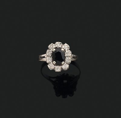 a black diamond and diamond cluster ring