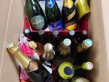 many bottles of wine in a box on the floor