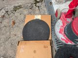 a red fire hydrant sitting next to a cardboard box on the ground