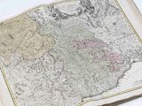 an open book with a map of england and wales on it