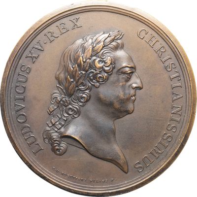 une image représentant une médaille de bronze sur laquelle figure la tête d'une femme
