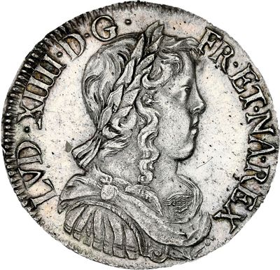 a silver coin with an image of a woman in profile
