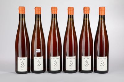 six bottles of wine lined up in a row