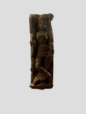 an image of a statue of a woman sitting on a rock