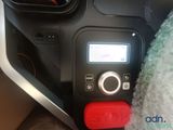 a close up of a car ' s dashboard with a remote control