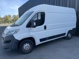 a white van parked in front of a building