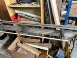 a pile of wood and metal items in a garage