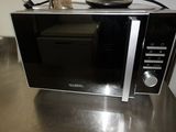 a microwave that is sitting on a counter in a kitchen