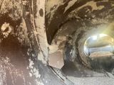 an image of a dirty pipe with a hole in it