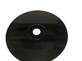 a black disc with a hole in the middle of it