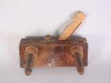 a wooden handle that is attached to a metal object