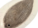 a picture of a white and black object with writing on it