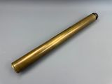 an old brass telescope on a table with a white background