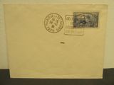 an old envelope with a stamp on it sitting on a table