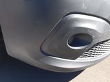 a close up of a car ' s front bumper