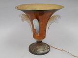 a brown vase with angel wings on it sitting on a table