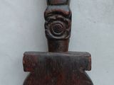 an image of a wooden sculpture of a cat on a stand