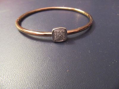 an image of a gold ring with diamonds on it