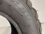 a close up of a tire on a white surface