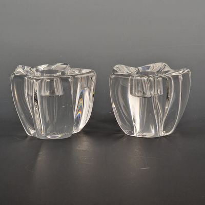 pair of clear glass vases on a black surface