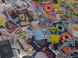 a pile of cards and other items on a table