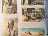several old photos of people and animals are displayed in a book