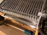 a grill that is sitting on a table in a room