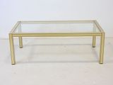 brass coffee table with glass top and metal legs