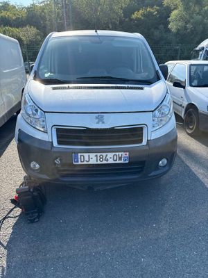 a white van that is parked in a parking lot
