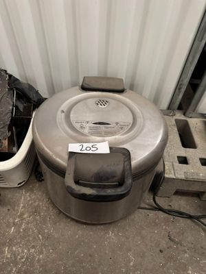 a trash can sitting next to a trash can and a trash can