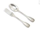 two silver spoons and a fork on a white surface