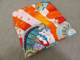 a small square pillow that has a picture of a horse on it
